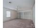 Spacious bedroom featuring carpet, neutral walls, a ceiling fan, and double closets at 2240 Armstrong Park Dr, Gastonia, NC 28054