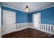 Dining room features blue walls, white trim, wood floors, and modern lighting at 2240 Armstrong Park Dr, Gastonia, NC 28054