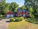 A beautiful two-story home with a two-car garage and lush landscaping at 2240 Armstrong Park Dr, Gastonia, NC 28054