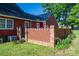 Exterior of red home featuring a brick patio and green grass at 2240 Armstrong Park Dr, Gastonia, NC 28054