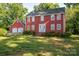 Charming two-story home with a well-maintained lawn and matching detached two-car garage at 2240 Armstrong Park Dr, Gastonia, NC 28054