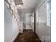 Foyer featuring a staircase with carpeted steps, decorative railings, and dark wood floors at 2240 Armstrong Park Dr, Gastonia, NC 28054