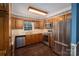 Kitchen featuring stainless steel appliances, wood cabinets, stone countertops and backsplash at 2240 Armstrong Park Dr, Gastonia, NC 28054