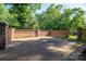 Brick patio surrounded by brick wall and lush greenery at 2240 Armstrong Park Dr, Gastonia, NC 28054