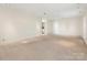 Spacious basement area with neutral carpet, bright recessed lighting, and access to other rooms at 232 Perrin Pl, Charlotte, NC 28207
