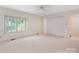 Bright bedroom with neutral carpet, large window, walk-in closet, and easy access at 232 Perrin Pl, Charlotte, NC 28207