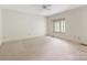 Spacious bedroom featuring neutral carpet, bright white walls, and a window nook at 232 Perrin Pl, Charlotte, NC 28207