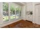 Sunlit breakfast nook with large windows and built-in cabinets at 232 Perrin Pl, Charlotte, NC 28207