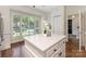 Bright kitchen featuring white cabinets, a center island, stainless steel appliances and lots of natural light at 232 Perrin Pl, Charlotte, NC 28207