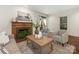 Cozy living room with a fireplace, neutral décor, and plenty of natural light at 232 Perrin Pl, Charlotte, NC 28207