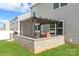 Enjoy the backyard patio with its pergola, outdoor grill, and peaceful vibe for outdoor entertainment at 2772 Sherrills Stream Dr, Sherrills Ford, NC 28673