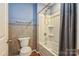 Clean bathroom with a shower-tub combo and tiled walls at 2772 Sherrills Stream Dr, Sherrills Ford, NC 28673