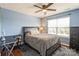 Comfortable bedroom with a ceiling fan, natural light, and a coordinated color scheme at 2772 Sherrills Stream Dr, Sherrills Ford, NC 28673