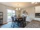 Cozy dining area with stylish chandelier and sliding glass door to the outside at 2772 Sherrills Stream Dr, Sherrills Ford, NC 28673
