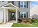 Inviting front entrance with a welcoming porch, decorative plants, and a stylish front door at 2772 Sherrills Stream Dr, Sherrills Ford, NC 28673