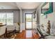 Bright foyer featuring hardwood floors, stylish decor, and a view of the front door at 2772 Sherrills Stream Dr, Sherrills Ford, NC 28673