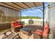 Relaxing patio area with comfortable wicker furniture and a grill perfect for entertaining at 2772 Sherrills Stream Dr, Sherrills Ford, NC 28673