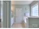 Well-maintained bathroom with a glass-enclosed shower, soaking tub, and decorative accents at 3009 Thayer Dr, Waxhaw, NC 28173