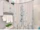 Bathroom featuring cabinet storage, a floral-patterned shower curtain, and white towels at 3009 Thayer Dr, Waxhaw, NC 28173