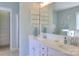 Well-lit bathroom featuring double sinks, ample counter space, a large mirror, and tiled floors at 3009 Thayer Dr, Waxhaw, NC 28173