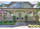 Inviting front porch with stone accents and hanging plants, perfect for relaxing at 3009 Thayer Dr, Waxhaw, NC 28173