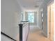 Upstairs hallway bathed in light, showcasing neutral carpeting and views to other rooms at 3009 Thayer Dr, Waxhaw, NC 28173