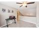 Neutral carpeted bedroom features a ceiling fan and plenty of natural light at 3032 Kilbeggan Dr, Clover, SC 29710