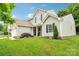 Charming two-story home with well-manicured lawn and tasteful landscaping at 3032 Kilbeggan Dr, Clover, SC 29710