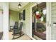 Inviting front porch with rocking chairs, seasonal wreath, and Ring doorbell at 3032 Kilbeggan Dr, Clover, SC 29710
