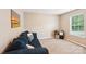 Comfortable living room featuring plush seating, neutral walls, and a bright window, perfect for relaxation at 3032 Kilbeggan Dr, Clover, SC 29710