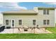 The backyard has a patio area with an outdoor seating, grill and grassy area at 3032 Kilbeggan Dr, Lake Wylie, SC 29710