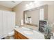 Well-lit bathroom with granite countertop, a framed mirror, and a shower with a curtain at 3032 Kilbeggan Dr, Lake Wylie, SC 29710