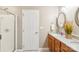 Bathroom with double sink vanity, granite countertops, and a glass-enclosed shower at 3032 Kilbeggan Dr, Lake Wylie, SC 29710