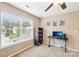 Bright bedroom featuring a ceiling fan, neutral walls, and a modern desk setup with a large window view at 3032 Kilbeggan Dr, Lake Wylie, SC 29710