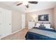 Cozy bedroom featuring a ceiling fan, neutral walls, and a white dresser with modern artwork at 3032 Kilbeggan Dr, Lake Wylie, SC 29710