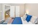 Open bedroom featuring view into the staircase with carpeted floors and blue quilt bed at 3032 Kilbeggan Dr, Lake Wylie, SC 29710