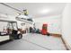 Spacious, clean garage with a golf cart, storage, and ample room for vehicles or hobbies at 3032 Kilbeggan Dr, Lake Wylie, SC 29710
