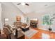 Inviting living room with hardwood floors, vaulted ceilings, comfortable seating, and modern entertainment center at 3032 Kilbeggan Dr, Lake Wylie, SC 29710