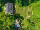 Aerial view of the home, detached garage, backyard firepit, and charming pond at 3243 Farmcrest Ct, Fort Mill, SC 29708