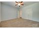 Bedroom with plush carpeting, a ceiling fan, and double closets at 3243 Farmcrest Ct, Fort Mill, SC 29708