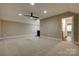 This spacious bonus room boasts neutral walls, carpet, recessed lighting and a fan at 3243 Farmcrest Ct, Fort Mill, SC 29708
