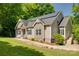 Charming home with solar panels, American flag, and well-maintained lawn at 3243 Farmcrest Ct, Fort Mill, SC 29708