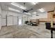 Open garage with two doors, ceiling fans, and built-in workbench, perfect for storage at 3243 Farmcrest Ct, Fort Mill, SC 29708
