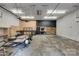 Spacious garage with workshop area and custom built-ins, ideal for projects at 3243 Farmcrest Ct, Fort Mill, SC 29708