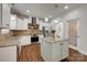 Charming kitchen with granite countertops, tile backsplash, stainless appliances, and island at 3243 Farmcrest Ct, Fort Mill, SC 29708