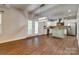 Bright kitchen with hardwood floors, stainless appliances, island, and French doors at 3243 Farmcrest Ct, Fort Mill, SC 29708