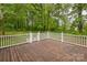 Wooden back deck and white railings overlooking the backyard and woods at 3585 Goodman Lake Rd, Salisbury, NC 28146