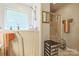 Bright bathroom with a walk-in tub, walk-in shower, and tile floors at 3585 Goodman Lake Rd, Salisbury, NC 28146