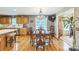 Dining room with hardwood floors, chandelier, and natural light connects to kitchen at 3585 Goodman Lake Rd, Salisbury, NC 28146