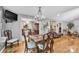 Dining room with chandelier and table set, opens to living room, and smaller dining room at 3585 Goodman Lake Rd, Salisbury, NC 28146